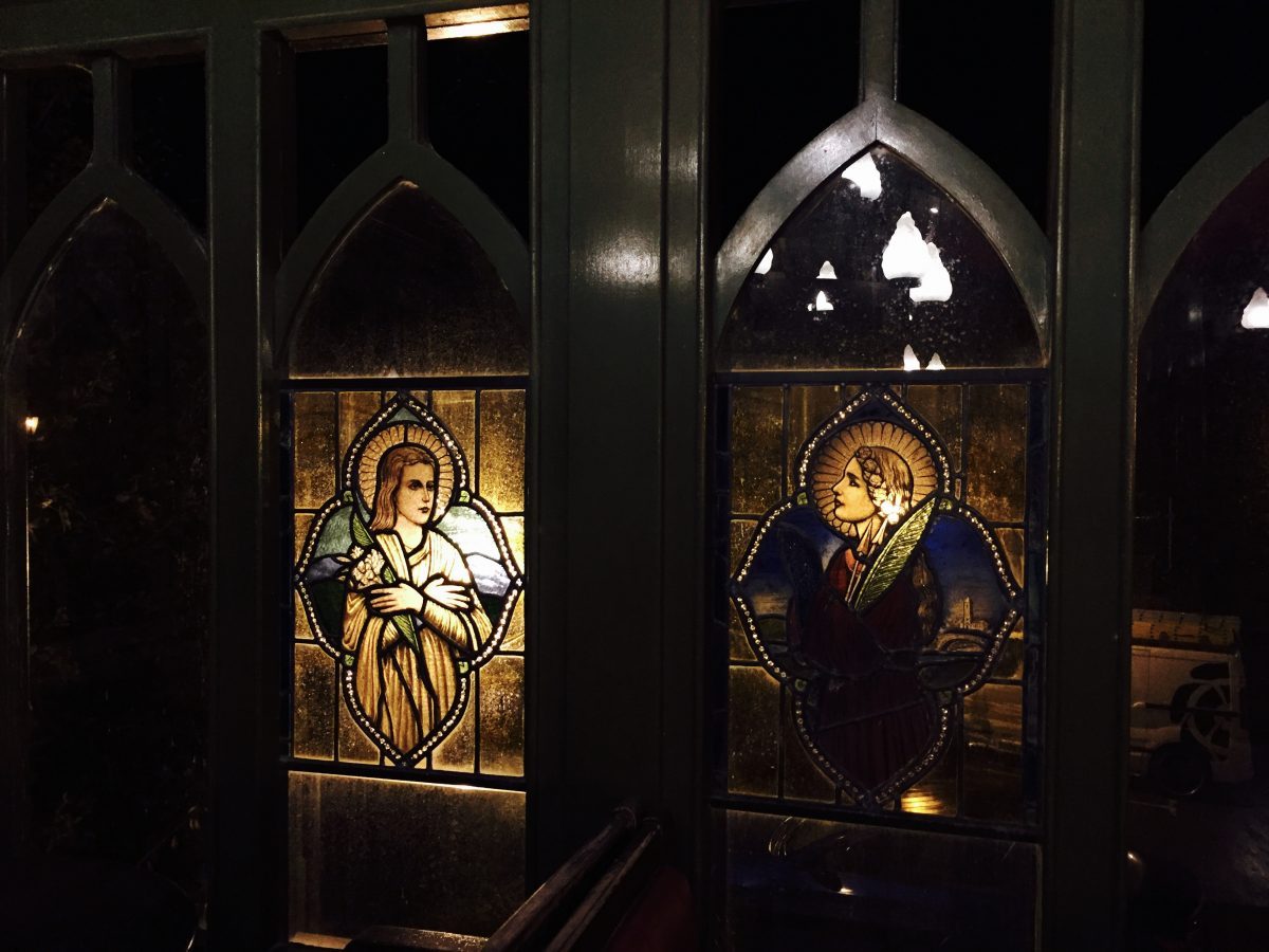A photo of stained glass windows at Crawfordsburn Inn, N. Ireland for the poem The Crawfordsburning - by Angela Josephine
